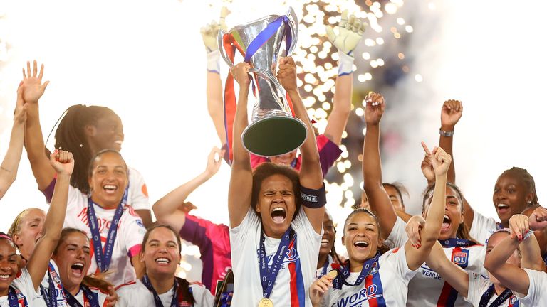 Lyon Women lifting the UEFA Women’s Champions League trophy.